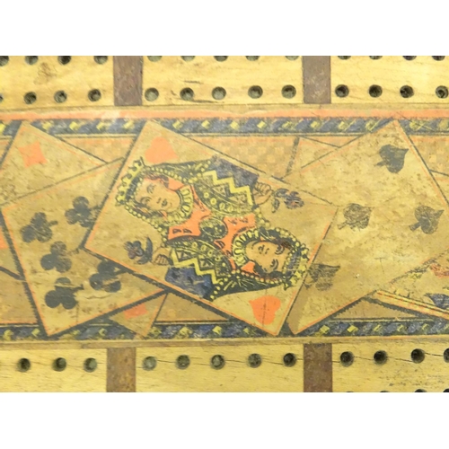 703 - Toys: A late 19th / early 20thC cribbage board with playing card decoration, together with a treen e... 