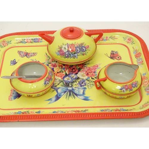 708 - Toys: A mid 20thC Chad Valley tinplate tea set in bright yellow decorated with sprays of flowers and... 