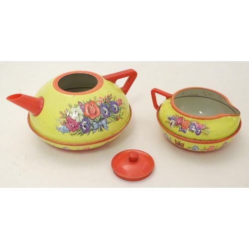 708 - Toys: A mid 20thC Chad Valley tinplate tea set in bright yellow decorated with sprays of flowers and... 