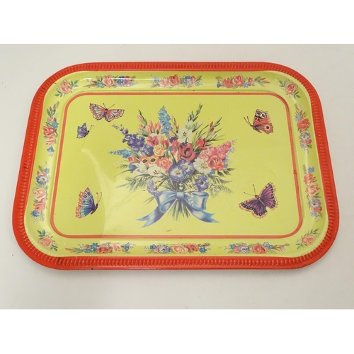 708 - Toys: A mid 20thC Chad Valley tinplate tea set in bright yellow decorated with sprays of flowers and... 