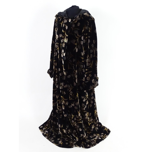 712 - A Vintage full length velvet coat with hood. Black with floral design. Hand made by 'Forget Me Not' ... 