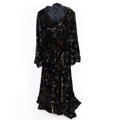 712 - A Vintage full length velvet coat with hood. Black with floral design. Hand made by 'Forget Me Not' ... 