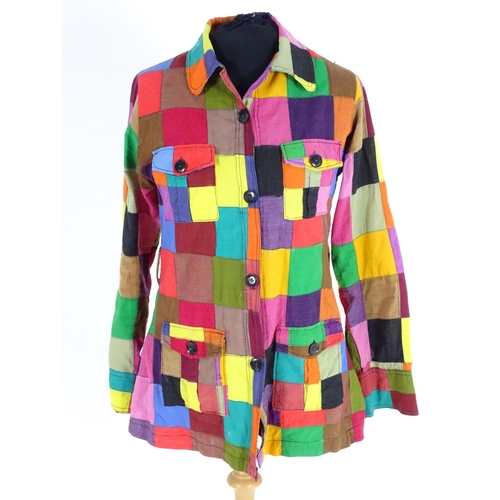 719 - A vintage multi coloured patchwork blouse/shirt with  patch pockets and belt loop. Bust size 32