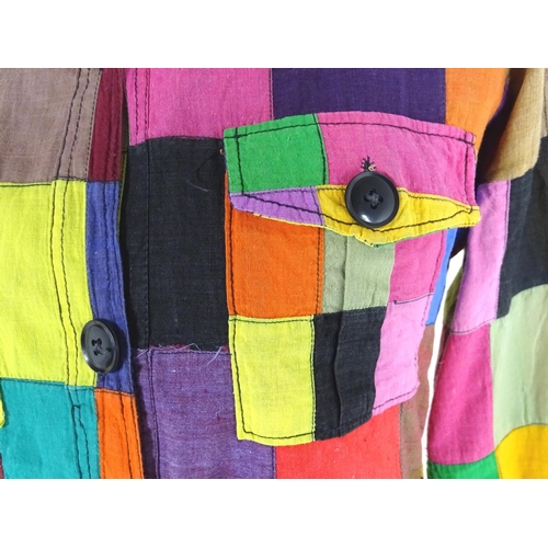 719 - A vintage multi coloured patchwork blouse/shirt with  patch pockets and belt loop. Bust size 32