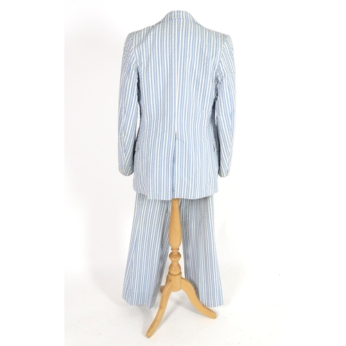 735 - 2 vintage stripy suits by Austins, a light brown and cream striped jacket and trousers along with a ... 