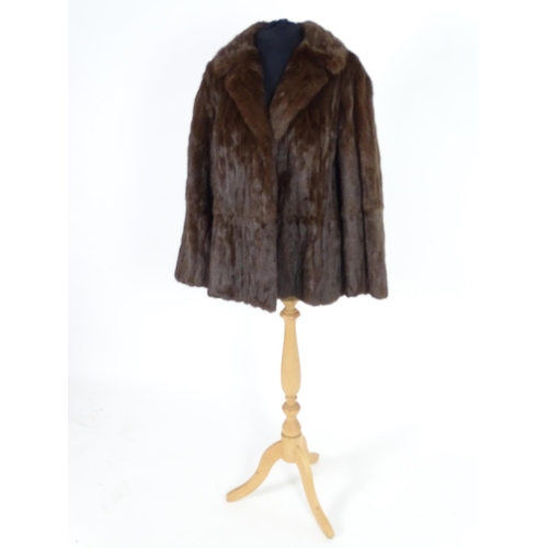 736A - A vintage short length fur coat. Bust size 38