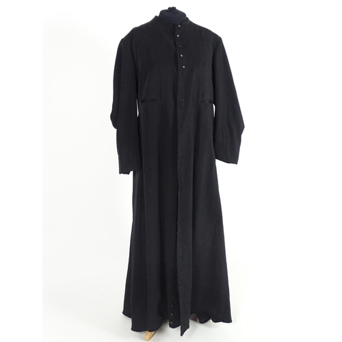 737 - A black full length clergymans' cassock. Chest size 40