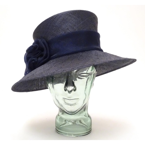 740 - A ladies navy hat