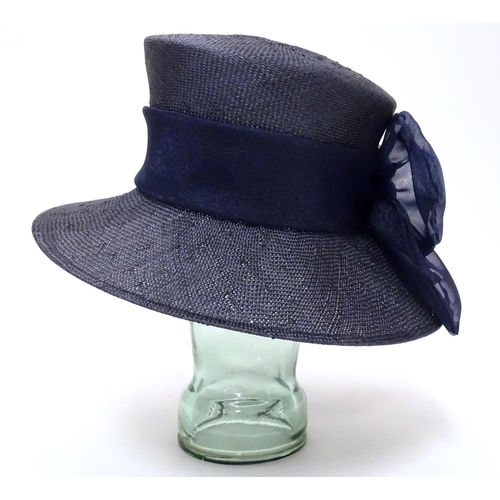 740 - A ladies navy hat