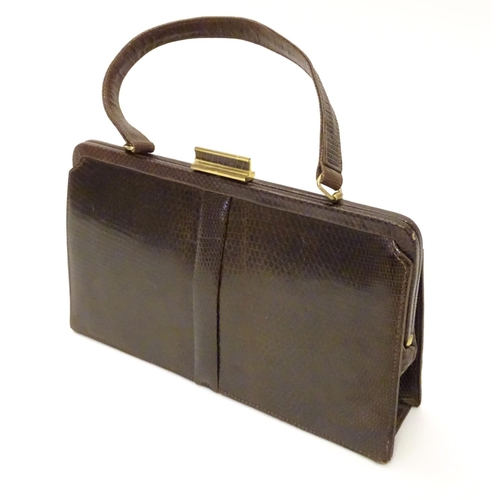 743 - A snakeskin leather bag by Mappin & Webb Ltd along with a matching Patrys compact (2)