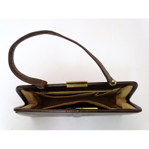 743 - A snakeskin leather bag by Mappin & Webb Ltd along with a matching Patrys compact (2)