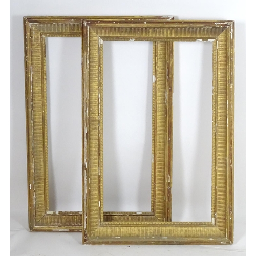 1690 - A pair of gilt and gesso moulded picture frames. Approx. 39 1/4