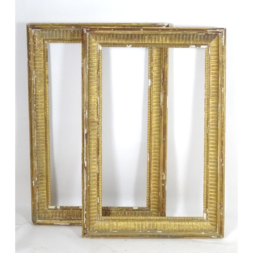 1690 - A pair of gilt and gesso moulded picture frames. Approx. 39 1/4