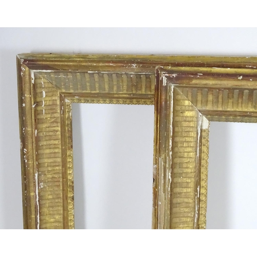 1690 - A pair of gilt and gesso moulded picture frames. Approx. 39 1/4