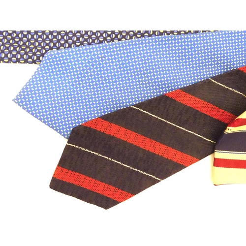 746 - 5 Turnbull & Asser, London silk ties in red and blue designs. (5)