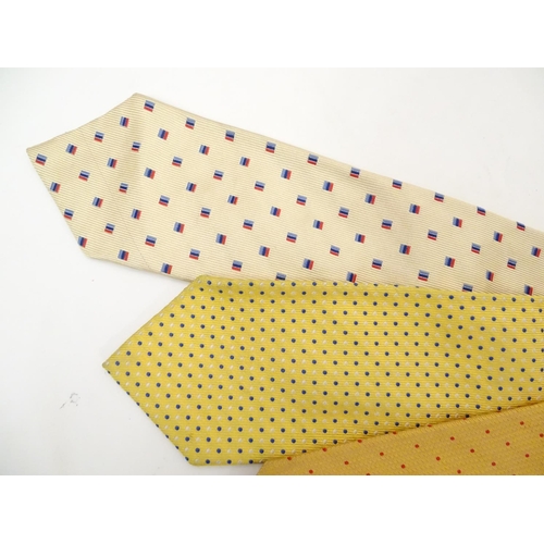 752 - 5 Turnbull & Asser, London silk ties, in yellow, cream, red and blue designs. (5)