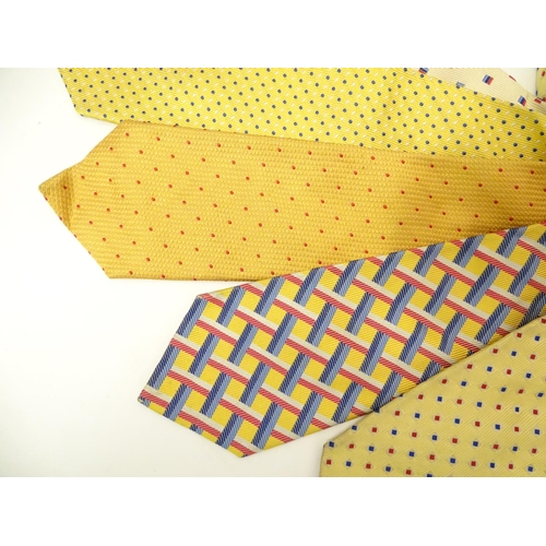 752 - 5 Turnbull & Asser, London silk ties, in yellow, cream, red and blue designs. (5)