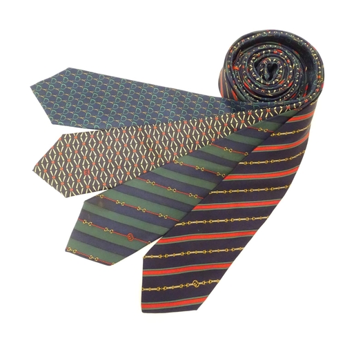 754 - 4 Gucci silk ties, various designs in greens, black and blues (4)