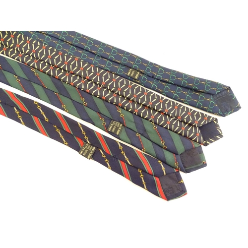 754 - 4 Gucci silk ties, various designs in greens, black and blues (4)