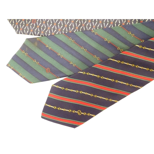 754 - 4 Gucci silk ties, various designs in greens, black and blues (4)