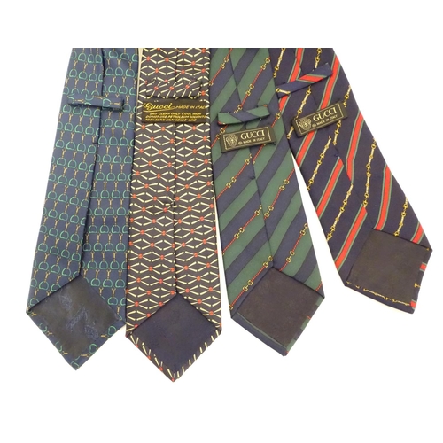 754 - 4 Gucci silk ties, various designs in greens, black and blues (4)