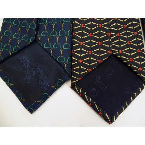 754 - 4 Gucci silk ties, various designs in greens, black and blues (4)