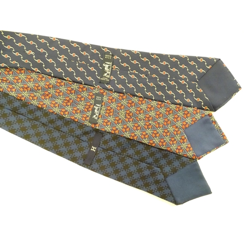 756 - 3 Hermes silk navy and red ties, of various designs (3)