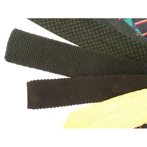 769 - 8 knitted ties in various colours and designs. (8)