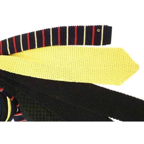 769 - 8 knitted ties in various colours and designs. (8)