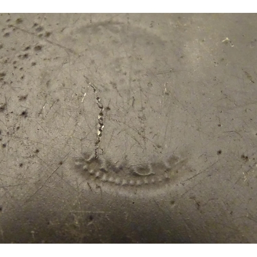 1131 - A pewter plate / charger  stamped to rim IHA, and  stamped with touch marks under. 15