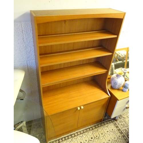 1240 - Vintage Retro, Mid Century: a Schreiber dresser bookcase, in teak finish with three shelves and cupb... 