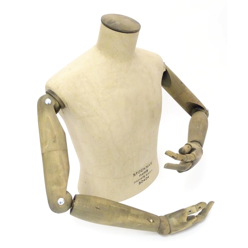 781 - A Stockman Paris mannequin, with turned hardwood articulated limbs, 22