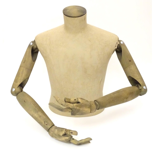 781 - A Stockman Paris mannequin, with turned hardwood articulated limbs, 22