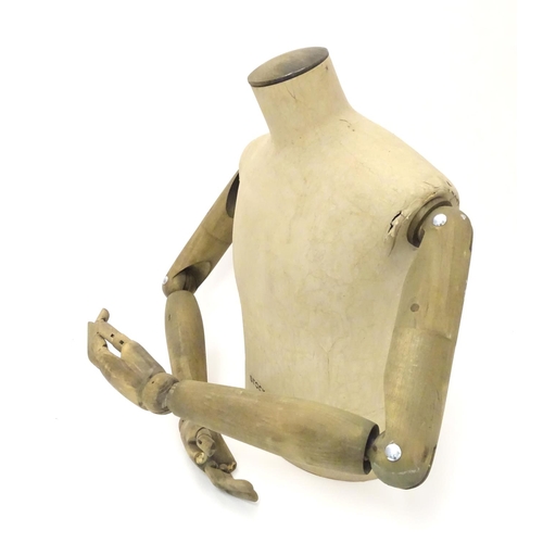 781 - A Stockman Paris mannequin, with turned hardwood articulated limbs, 22