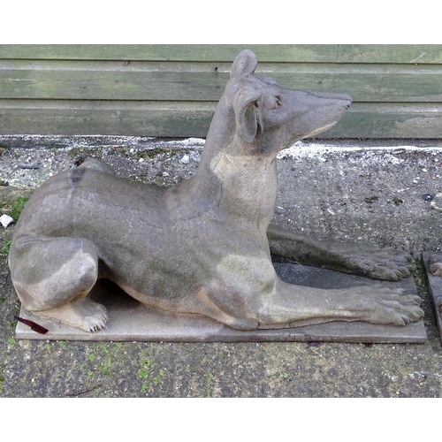 782 - Garden & Architectural, Salvage: a pair of stone garden ornaments formed as couchant hounds / dogs u... 