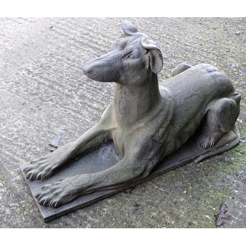 782 - Garden & Architectural, Salvage: a pair of stone garden ornaments formed as couchant hounds / dogs u... 