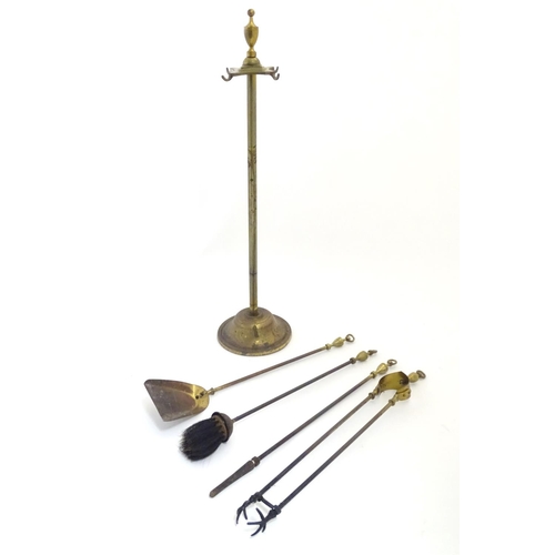 790 - Garden & Architectural, Salvage: an early to mid 20thC brass fireside companion set, comprising brus... 