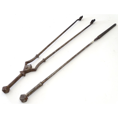 791 - A pair of 19thC Gothic Revival wrought iron fire tools, comprising tongs and poker, each having octa... 