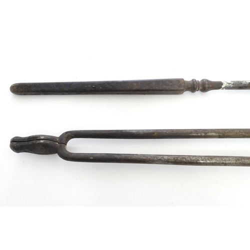 791 - A pair of 19thC Gothic Revival wrought iron fire tools, comprising tongs and poker, each having octa... 