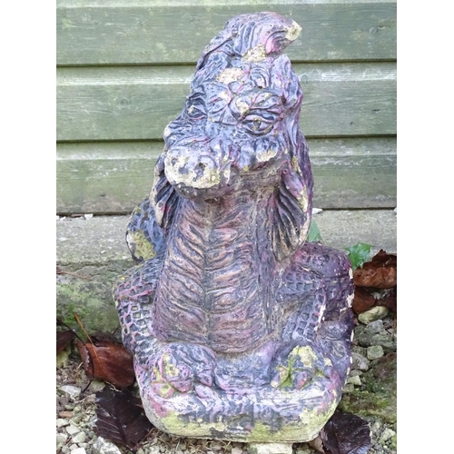 797 - Garden & Architectural, Salvage: a pair of mid 20thC cast stone pillar ornaments formed as dragon he... 