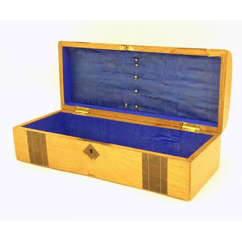 1003 - A late 19th / early 20thC glove box with a domed lid and banded decoration and inlaid stringing deta... 