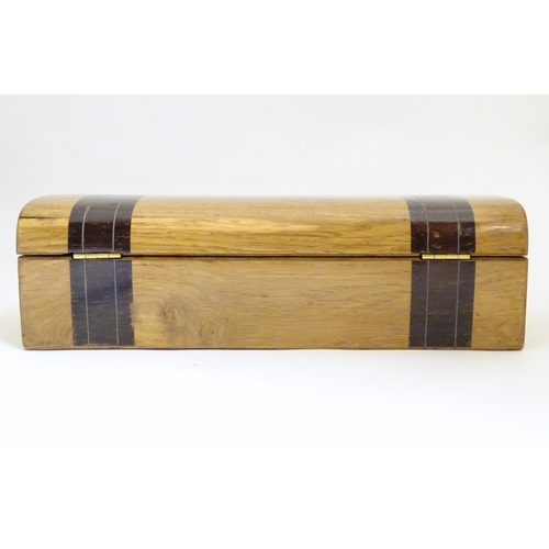 1003 - A late 19th / early 20thC glove box with a domed lid and banded decoration and inlaid stringing deta... 