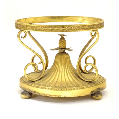 1005 - A c.1903 Elkington & Co. gilt metal oval centrepiece stand with scrolling decoration and central pin... 