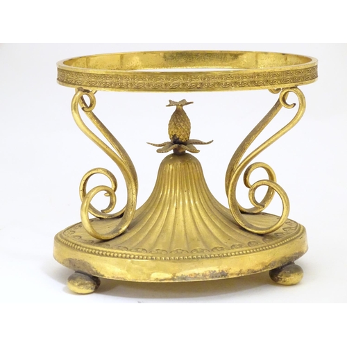 1005 - A c.1903 Elkington & Co. gilt metal oval centrepiece stand with scrolling decoration and central pin... 