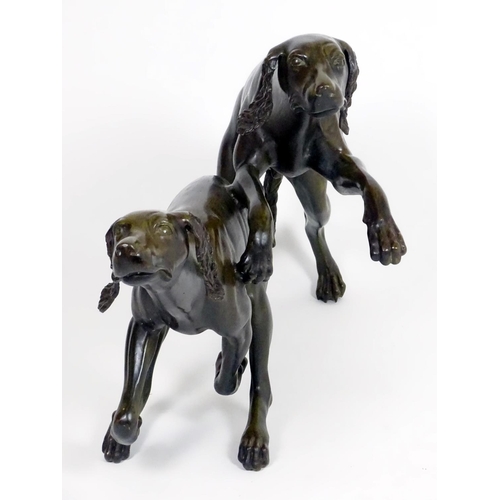 1011 - A 20thC large bronze sculpture modelled as two dogs / hounds running. Approx. 25