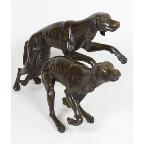 1011 - A 20thC large bronze sculpture modelled as two dogs / hounds running. Approx. 25