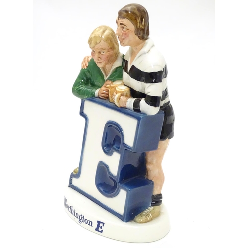 1120 - Brewiana : A Beswick bar top adverting figure group for ' Worthington E ' . Depicting rugby players ... 