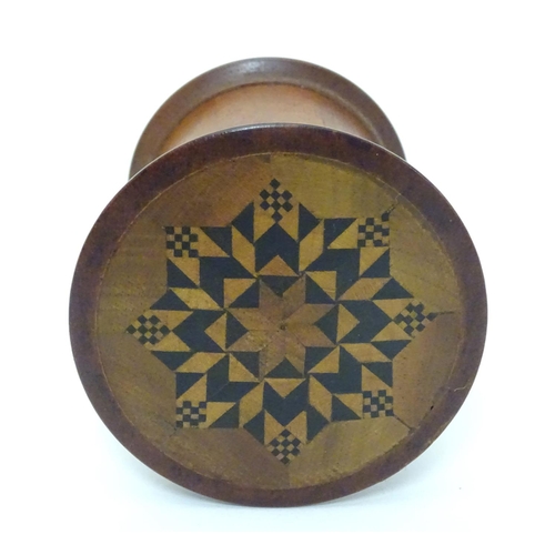 1124 - Kitchenalia : A 20thC treen nutmeg grater / container with parquetry style decoration to top