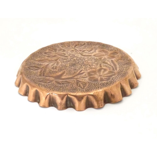 802 - An Arts & Crafts style copper tray with repousse floral decoration and punch detail. Approx. 8