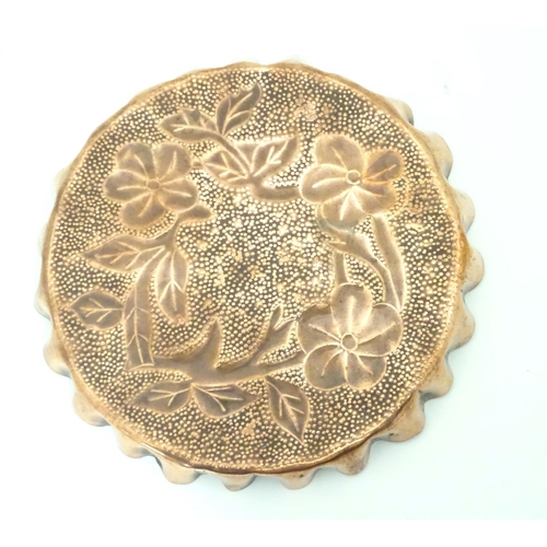 802 - An Arts & Crafts style copper tray with repousse floral decoration and punch detail. Approx. 8